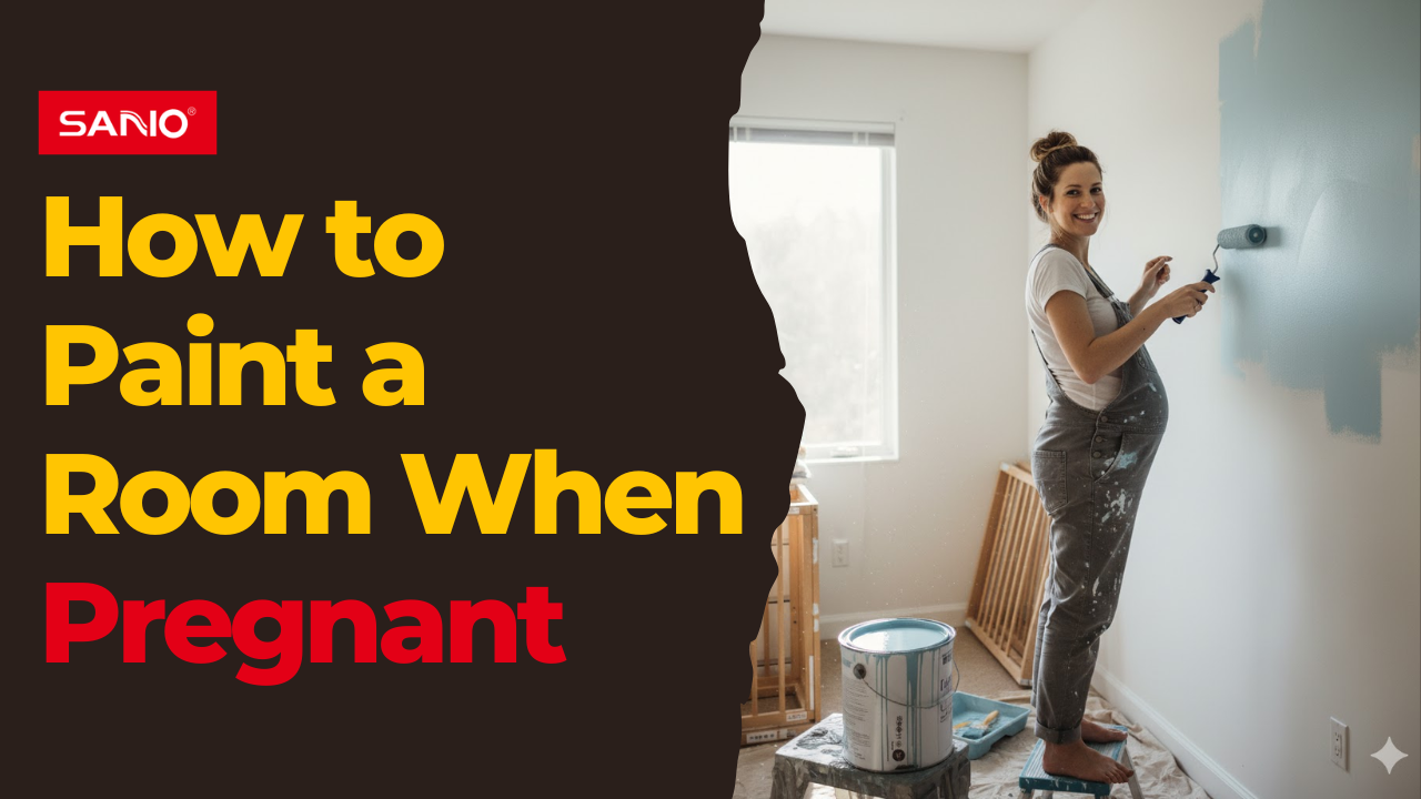 A pregnant woman is painting a wall